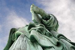 07-03 Statue Of Liberty Side View Of Her Enormous Hand Holding A Book With Folds Of Her Clothing From Pedestal
